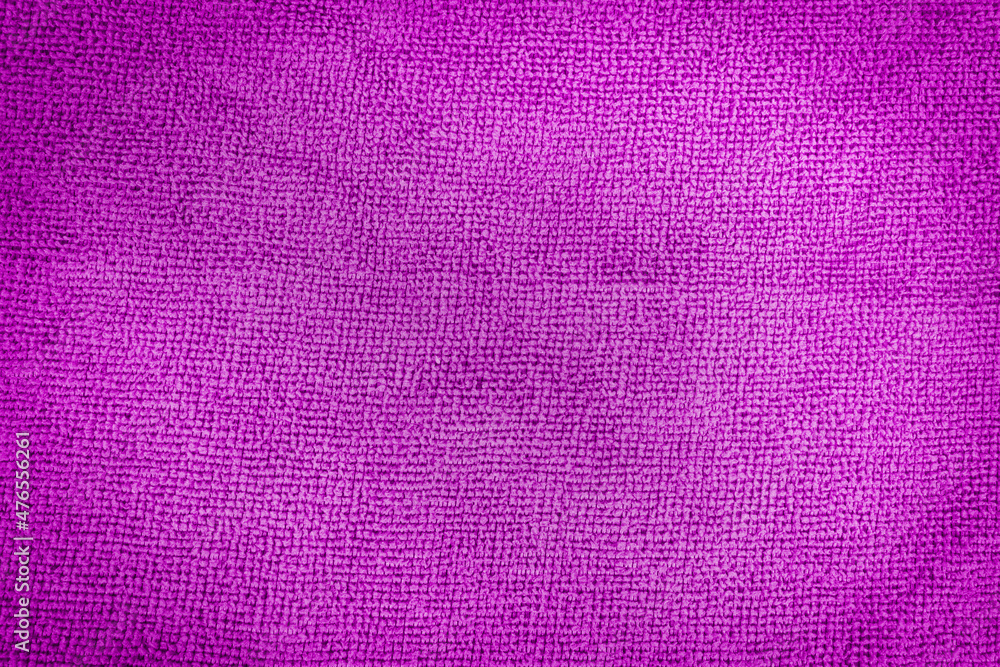 Close-up of abstract fabric texture as background for text or interior design. Purple artificial fabric texture.  