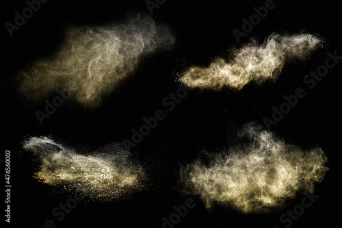 set of golden powder splash on black background