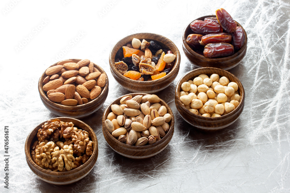 nuts and dried fruits in bamboo plates nuts and dried fruits in bamboo plates