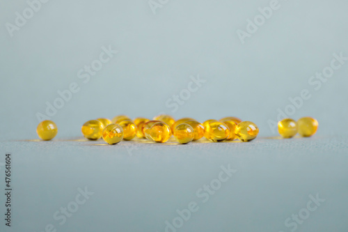Vitamin D ( omega 3 ) capsules on a light background. Copy space.