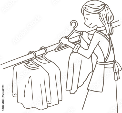 洗濯物を干す女性の線画