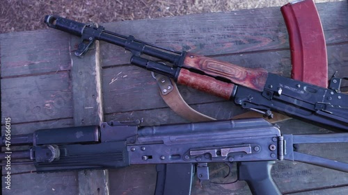 Kalashnikov assault rifles on military boxes.