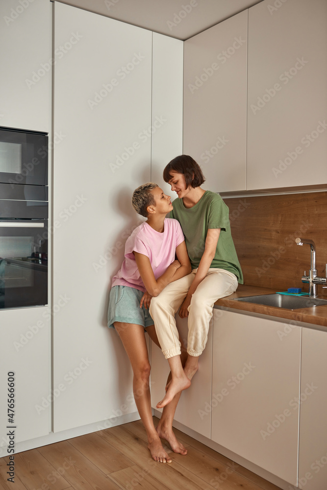 Girls spending time together at home kitchen Girls spending time together at home kitchen