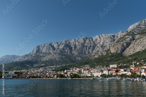 Landscape of Makarska town in the Adriatic sea coast under the Biokovo mountain in Croatia, during summer sunny day