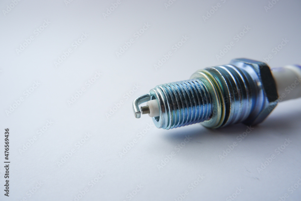 Auto parts. Car spark plugs. Spark plugs of a gasoline internal combustion engine. Space for text Auto parts. Car spark plugs. Spark plugs of a gasoline internal combustion engine. Space for text