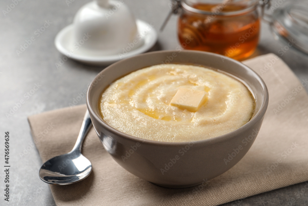 Delicious semolina pudding served on grey table Delicious semolina pudding served on grey table