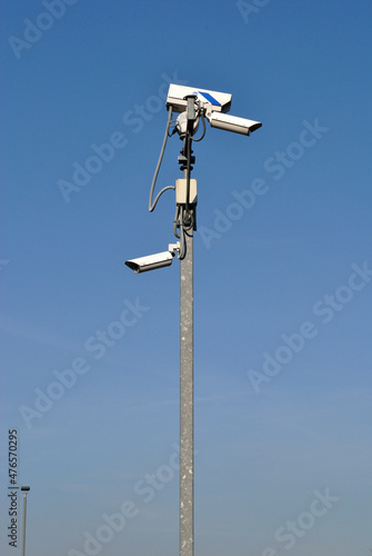 CCTV Cameras on Tall Metal Pole seen against Blue Sky
