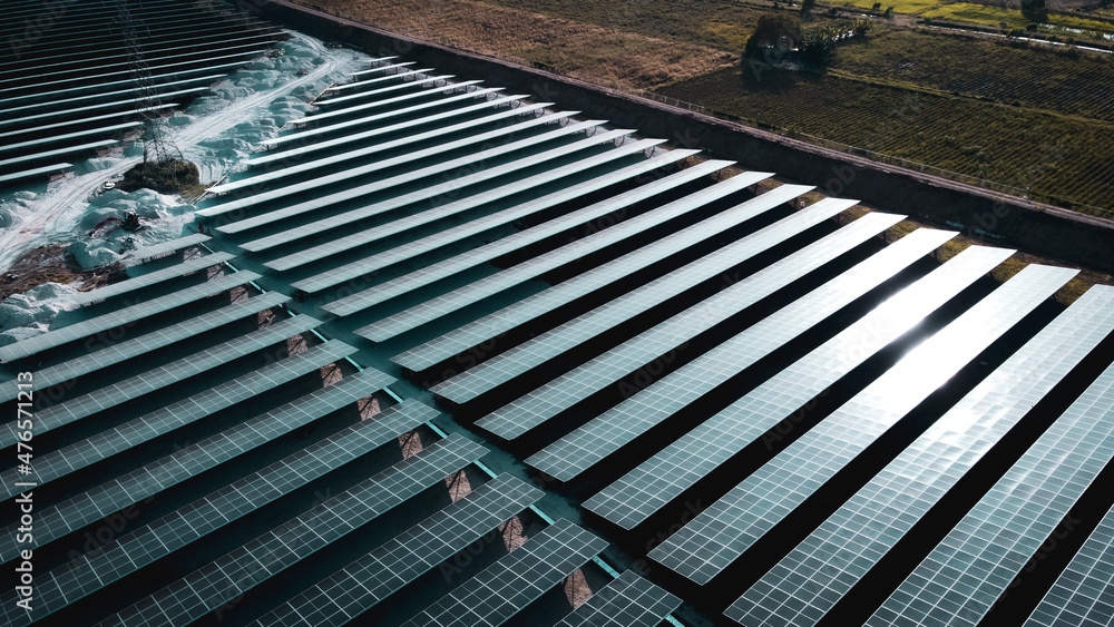 Solar cell panel from aerial view. Photo landscape of a solar farm producing clean energy. Solar cell panel from aerial view. Photo landscape of a solar farm producing clean energy.