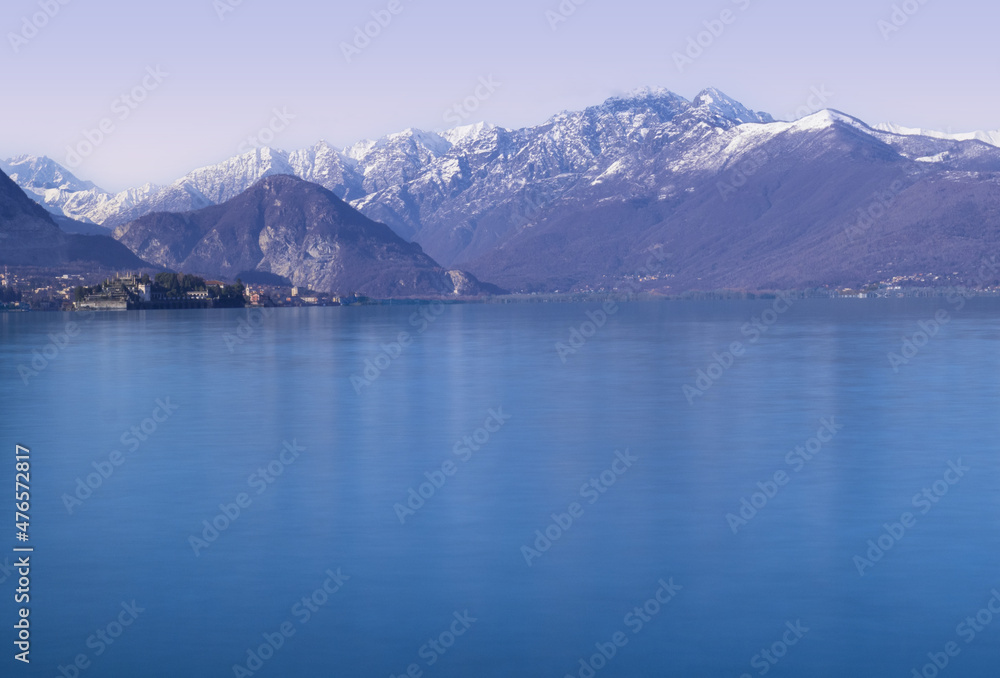 early morning panorama on calm lake, winter landscape of italian lakes.Lake Maggiore,Italy.