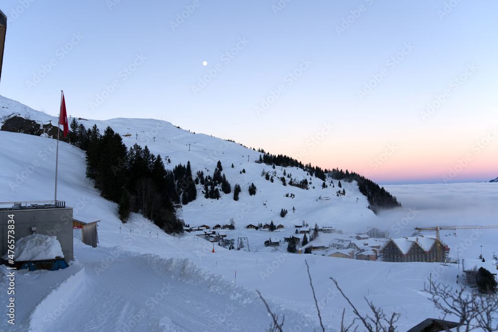 Swiss mountain village Stoss, Canton Schwyz, on a beautiful winter morning. Photo taken December 21st, 2021, Stoos, Switzerland. Swiss mountain village Stoss, Canton Schwyz, on a beautiful winter morning. Photo taken December 21st, 2021, Stoos, Switzerland.