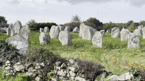 Fast panning shot on the Carnac Stones menhirs (Brittany, France) photo