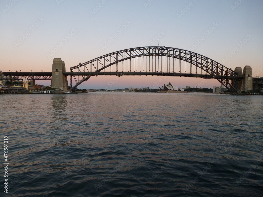 Sydney Harbour Bridge with the Opera House in the background seen from the west side at dusk, Sydney, New South Wales, Australia