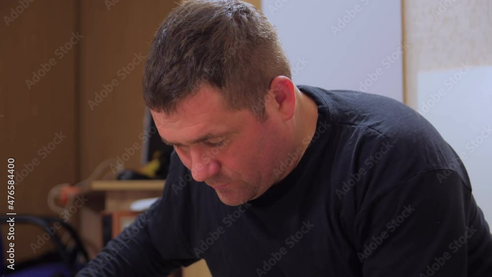 Man at home assemble furniture closeup indoors Man at home assemble furniture closeup indoors