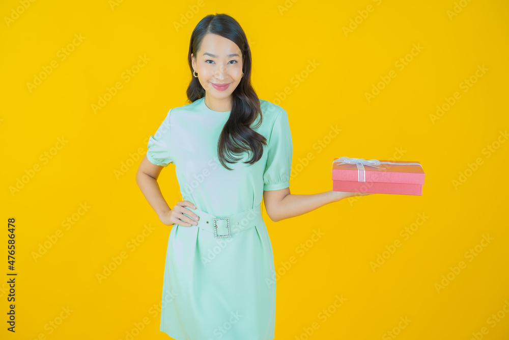 Portrait beautiful young asian woman smile with red gift box Portrait beautiful young asian woman smile with red gift box