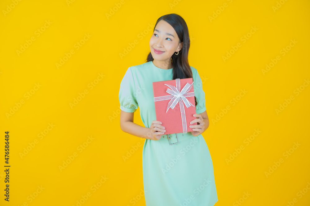Portrait beautiful young asian woman smile with red gift box Portrait beautiful young asian woman smile with red gift box