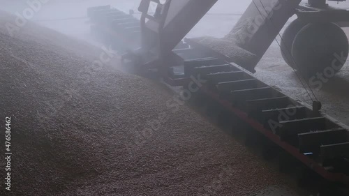 loading grain into warehouses using a loader