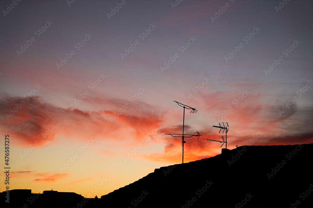 Obraz premium silhouette of television antennas at sunset