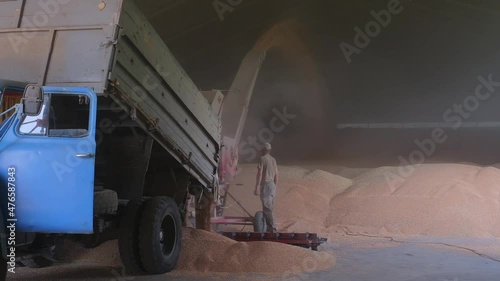 loading grain into warehouses using a loader