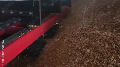 loading grain into warehouses using a loader
