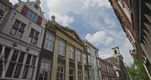 POV shot, walking on Groenmarkt in Dordrecht, the Netherlands looking up. Sunny summer day.