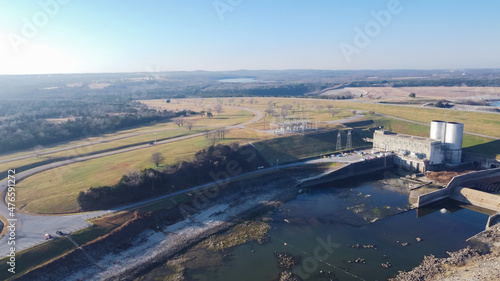 Aerial view Texas side of Denison Dam with hydroelectric turbine powerhouse impounds Lake Texoma