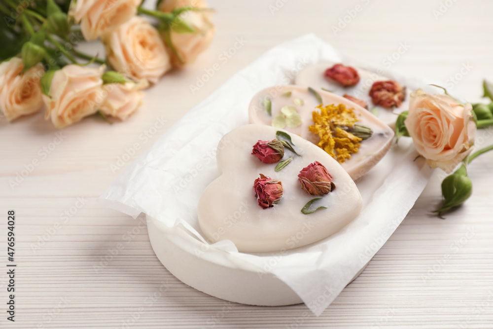 Tray with scented sachets on white wooden table Tray with scented sachets on white wooden table