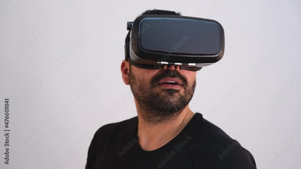 Young man in VR glasses headset gesturing portrait. Virtual reality, future technology, education video gaming Young man in VR glasses headset gesturing portrait. Virtual reality, future technology, education video gaming