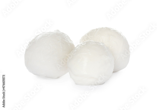 Delicious mozzarella cheese balls on white background