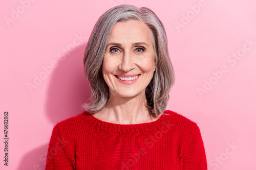 Portrait of nice-looking attractive cheerful content gray-haired woman employee isolated over pink pastel color background