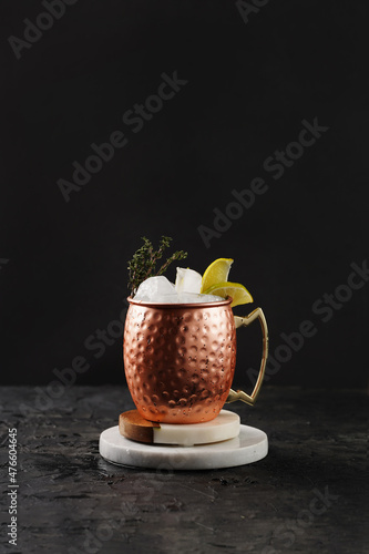 Canvas Print Traditional american alcoholic beverage moscow mule in copper mug with lemon and