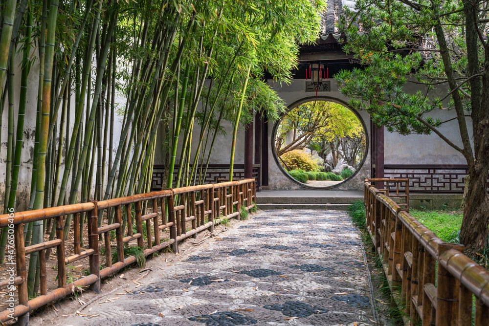 Circular doorway at a classical Chinese garden with bamboo trees, Suzhou, China