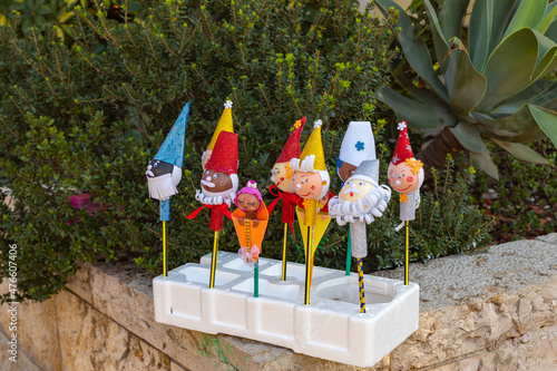 Several  different toys on sticks for Christmas for sale on Sderot Ben Gurion Street in the Haifa city in northern Israel photo