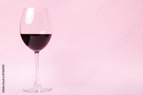 One glasses of red wine at wine tasting. Concept of red wine on colored background. Top view, flat lay design