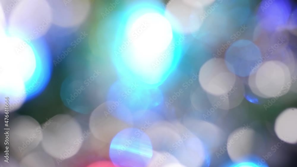 Defocusing a decorated Christmas tree. Bokeh glare is multicolored. Shiny spots Defocusing a decorated Christmas tree. Bokeh glare is multicolored. Shiny spots