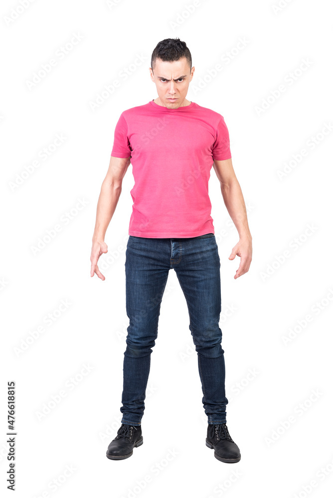 Aggressive man frowning and confronting camera Aggressive man frowning and confronting camera