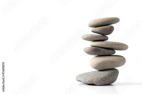 Canvas Print Pyramid of various sea pebbles, pyramid of balanced stones Isolated on white background