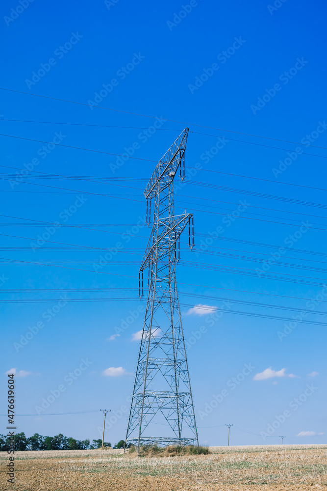Electric power transmission lines at sky background, autumn field Electric power transmission lines at sky background, autumn field