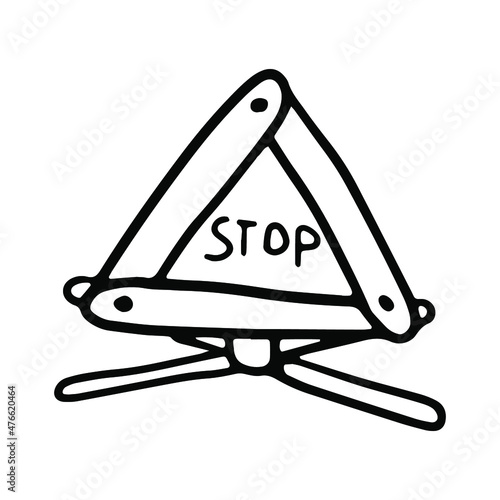 Warning triangle in doodle style. Isolated vector.