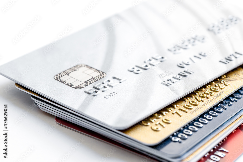 pile of credit cards on white background