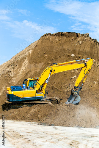 Wallpaper Mural Yellow excavator working digging in sand quarry Torontodigital.ca
