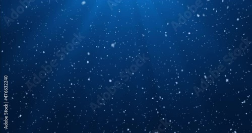 Shining snow background. Falling snow on a dark blue background. 4k Looped Motion Graphics