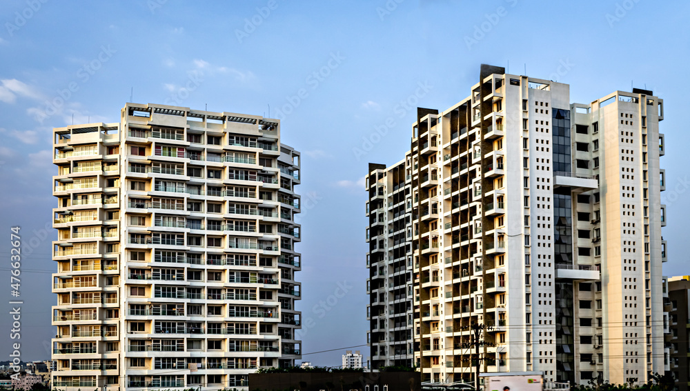 High rise, modern tall buildings with clear blue sky background.