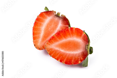 Ripe sweet strawberries and strawberry slices on wooden background with copy space.top view, flat lay.