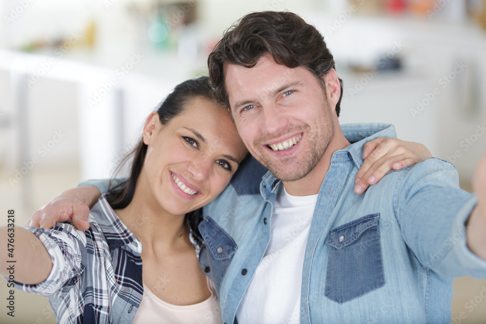 portrait of two happy lovers making selfie on smartphone portrait of two happy lovers making selfie on smartphone