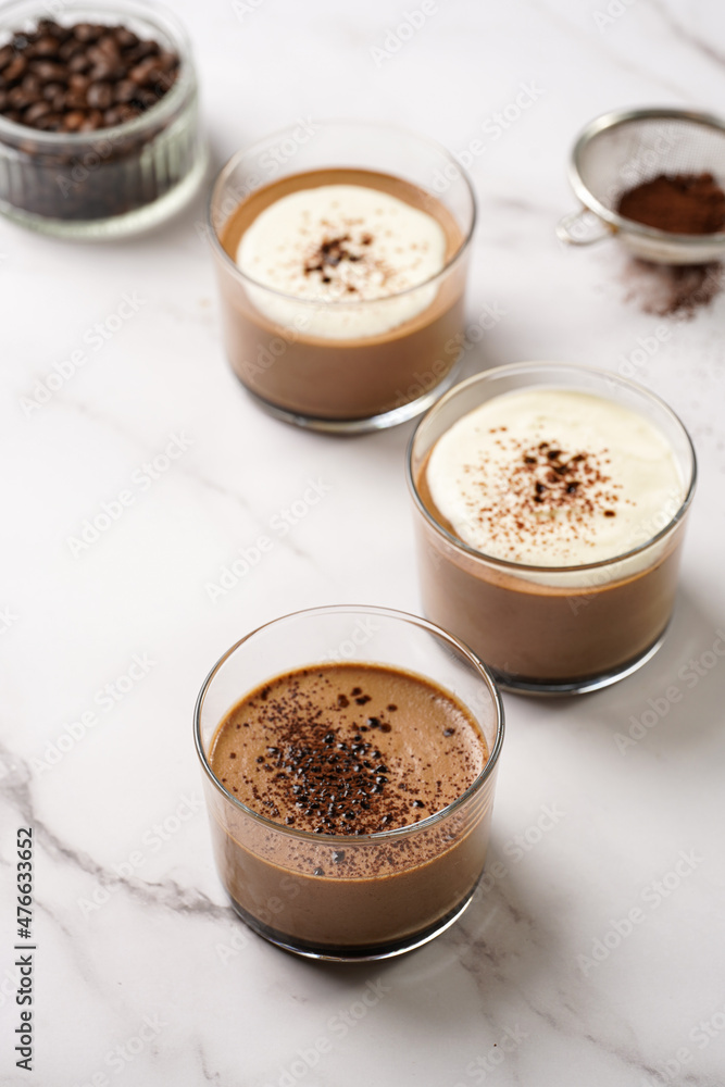 Italian chocolate and coffee mousse dessert semifreddo - half-frozen ice cream with whipped cream and cocoa powder in small glasses Italian chocolate and coffee mousse dessert semifreddo - half-frozen ice cream with whipped cream and cocoa powder in small glasses