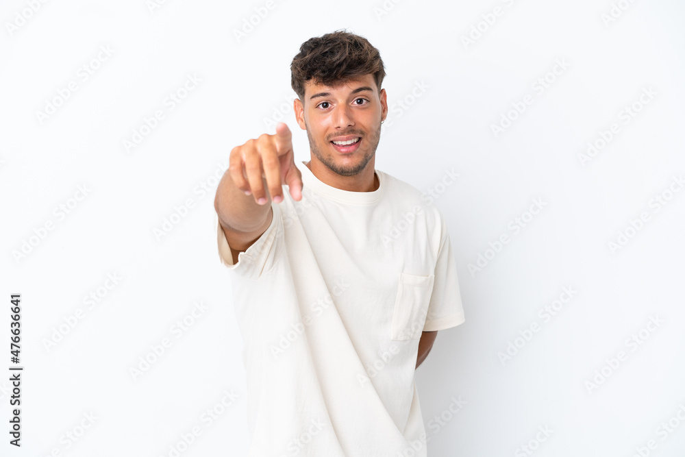 Young caucasian handsome man isolated on white background pointing front with happy expression Young caucasian handsome man isolated on white background pointing front with happy expression