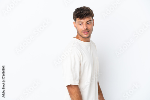 Young caucasian handsome man isolated on white background . Portrait © luismolinero