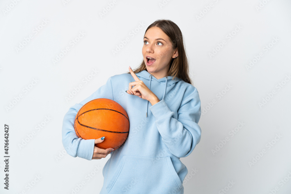 Young Lithuanian woman playing basketball isolated on white background intending to realizes the solution while lifting a finger up Young Lithuanian woman playing basketball isolated on white background intending to realizes the solution while lifting a finger up