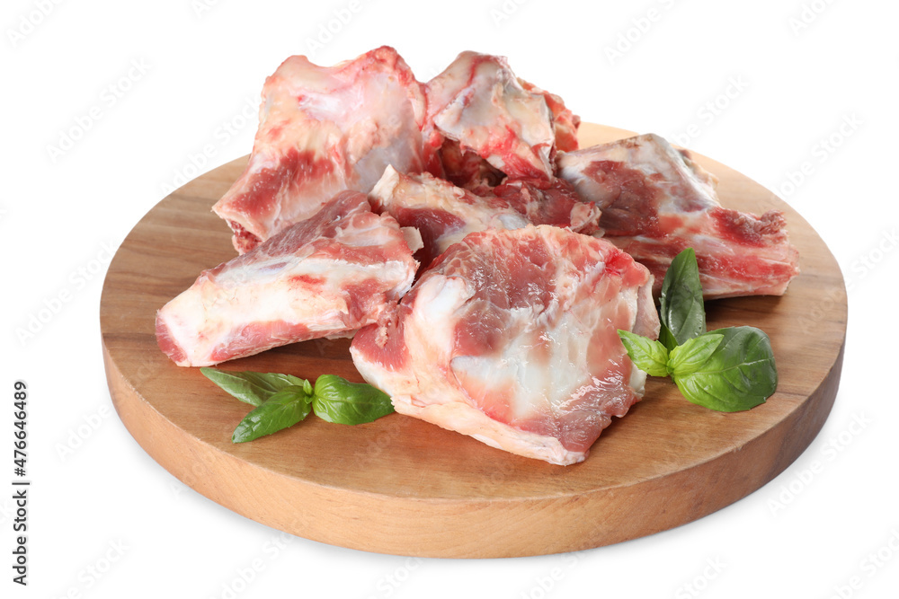 Raw meaty bones and basil on white background