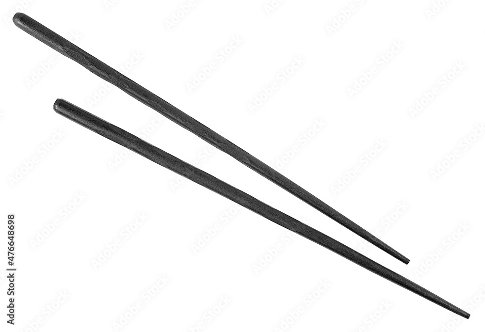 Black wooden chopsticks isolated on a white background, top view. Black wooden chopsticks isolated on a white background, top view.